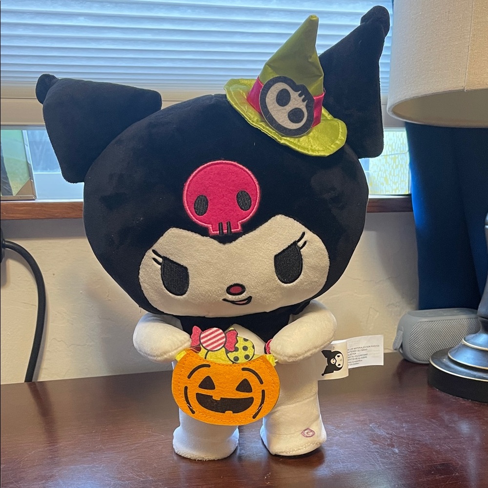 Cute Black and White Plush Toy with Pink Accents